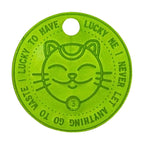 Close-up of the neon green Lucky Coin by LUCKY TO HAVE® – a stylish trolley token and lucky charm.