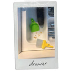 LUCKY TO HAVE® mini dustpan and brush cleaning food crumbs inside a kitchen drawer, enabling precise removal of fine residues in tight spaces.