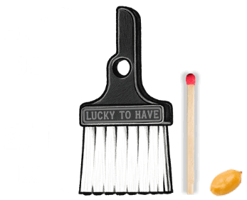 LUCKY TO HAVE® mini broom with size comparison graphic showing 6.9 cm / 2.7 in height, displayed next to a matchstick and small candy for scale on a transparent background.