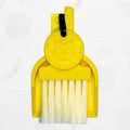 LUCKY TO HAVE® yellow mini dustpan set presented in front of the signature brand-style wallpaper.