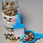 LUCKY TO HAVE dustpan saving spices by pouring them back into the container to avoid waste.