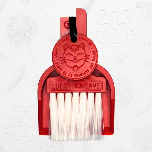 LUCKY TO HAVE® Lucky Bordeaux mini broom and pan set in red, complete kit with broom, dustpan and Lucky Coin, shown on the signature brand background.