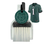 Custom Lucky by LUCKY TO HAVE® with a black broom, white pan and dark green Lucky Coin, inspired by the Philadelphia Eagles’ team colours, shown beside a green Eagles jersey.