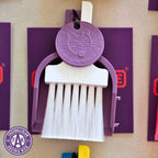 Custom Lucky by LUCKY TO HAVE® with a white broom, purple pan and purple Lucky Coin, inspired by FK Austria Wien’s team colours, with the club logo shown beside it.